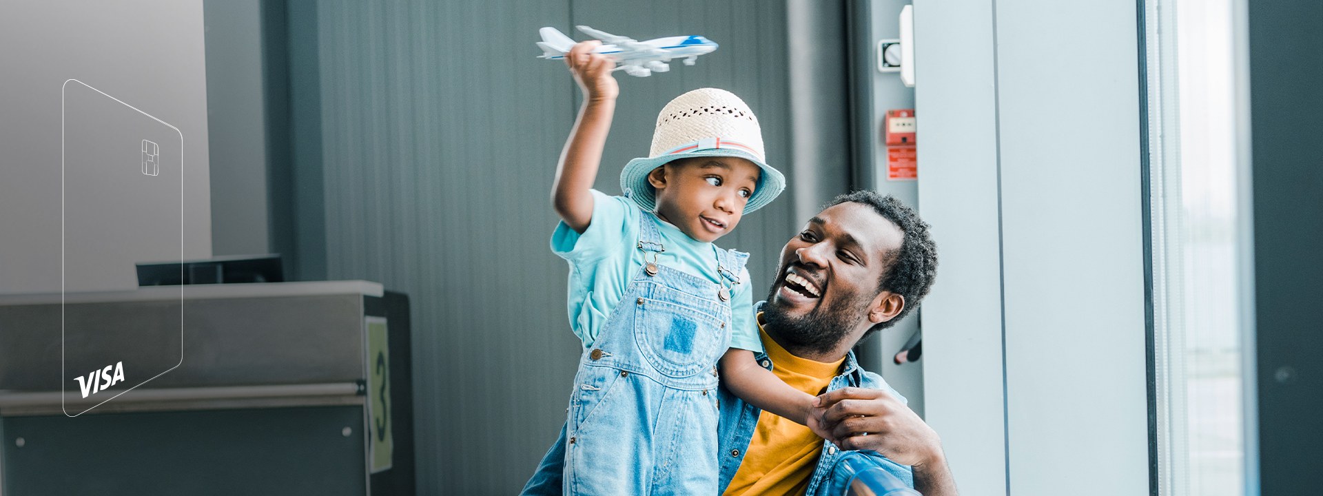 A father and a son playing a toy plane at the airport